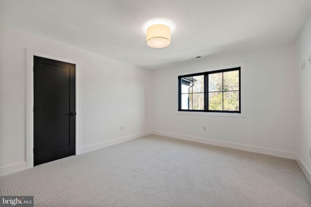 spare room featuring carpet flooring