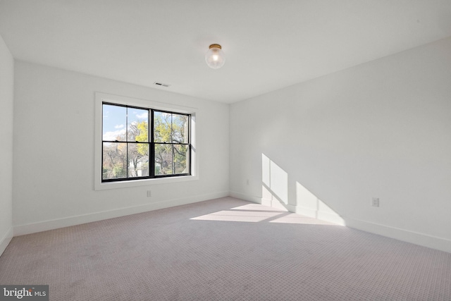 empty room with light colored carpet