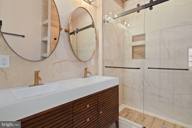 bathroom featuring vanity, tasteful backsplash, tiled shower, and tile walls