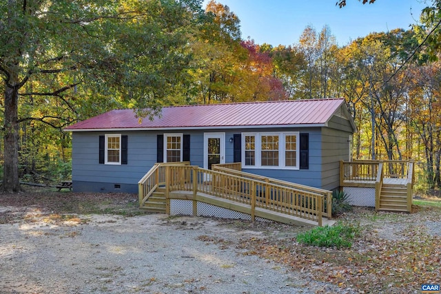 ranch-style house with a wooden deck