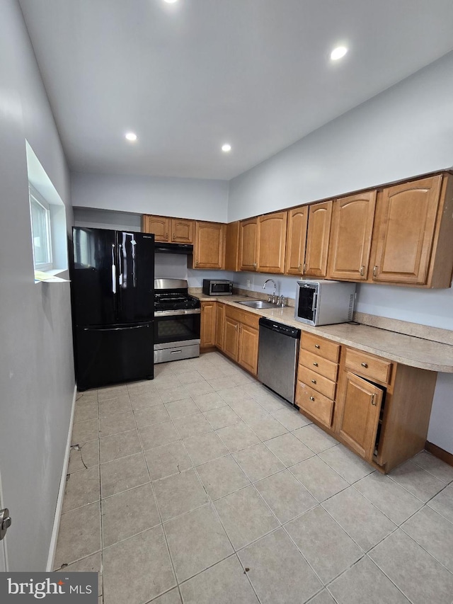 313 Pennell St, Chester, PA 19013 - kitchen featuring recessed lighting, brown cabinetry, stainless steel appliances, light countertops, and a sink