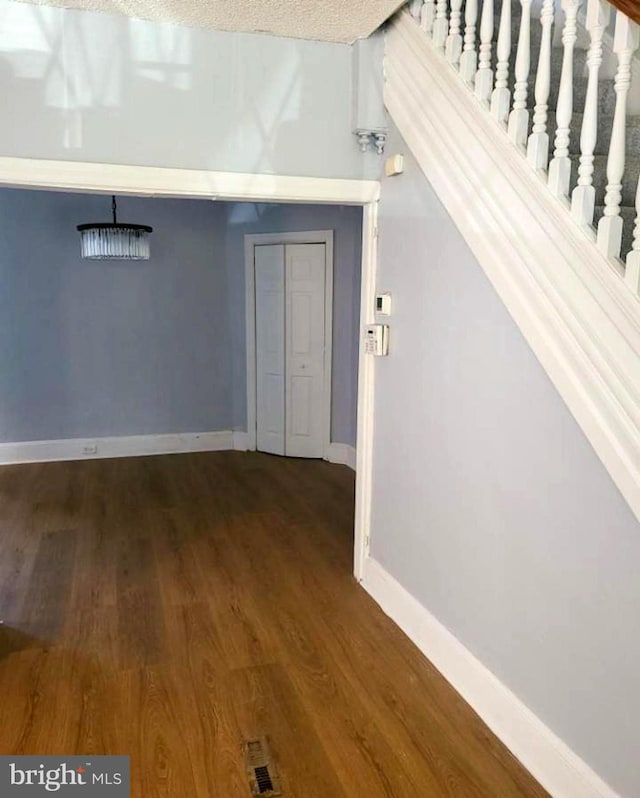 313 Pennell St, Chester, PA 19013 - interior space featuring visible vents, wood finished floors, and baseboards