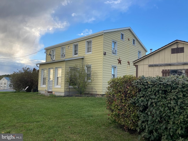 view of front of property with a front lawn