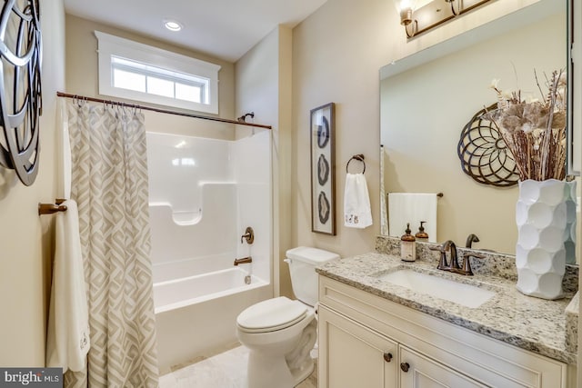 full bathroom with vanity, toilet, and shower / tub combo