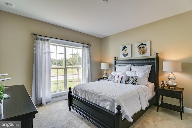 bedroom featuring light carpet