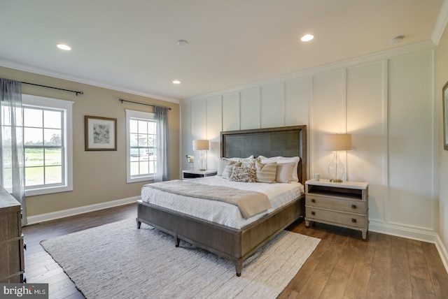 bedroom featuring crown molding and wood-type flooring