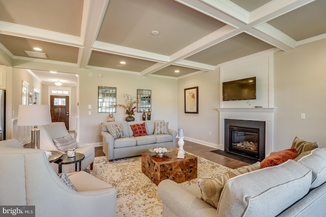 living room with ornamental molding, beam ceiling, coffered ceiling, and wood-type flooring