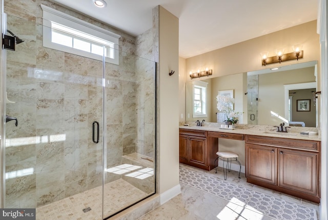 bathroom featuring vanity, tile patterned floors, a healthy amount of sunlight, and walk in shower