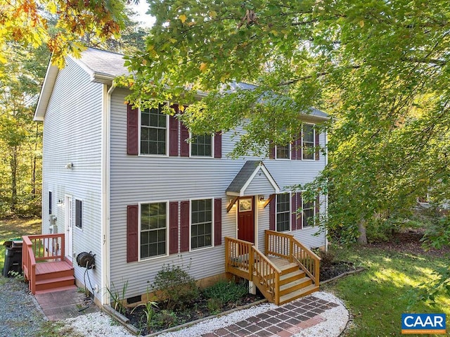 view of front facade with a wooden deck