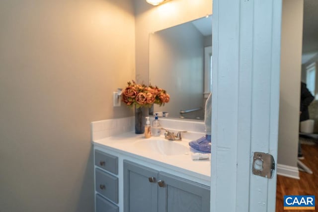 bathroom featuring vanity and hardwood / wood-style flooring