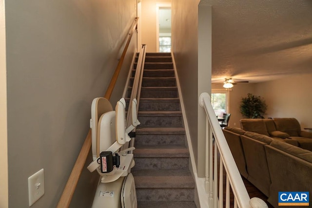 stairs with ceiling fan