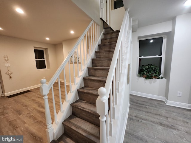 stairway featuring wood-type flooring