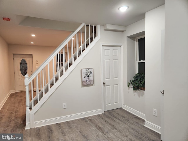 stairs with wood-type flooring