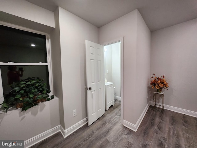 hallway featuring dark wood-type flooring