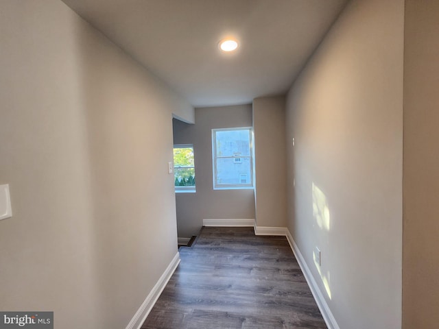 hall with dark wood-type flooring