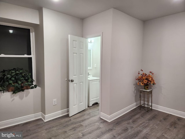 spare room with dark wood-type flooring