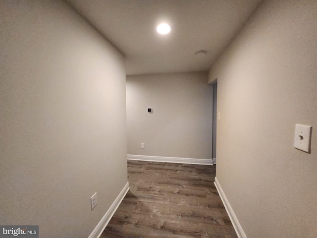 corridor featuring dark hardwood / wood-style floors