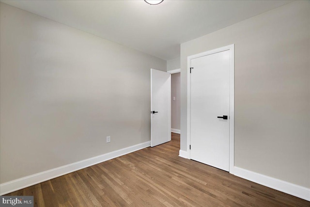 empty room featuring wood-type flooring