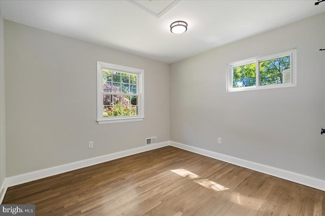 spare room featuring hardwood / wood-style floors