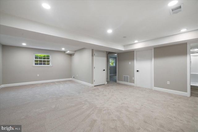 basement with light colored carpet