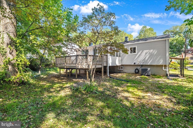 back of house featuring central AC and a wooden deck