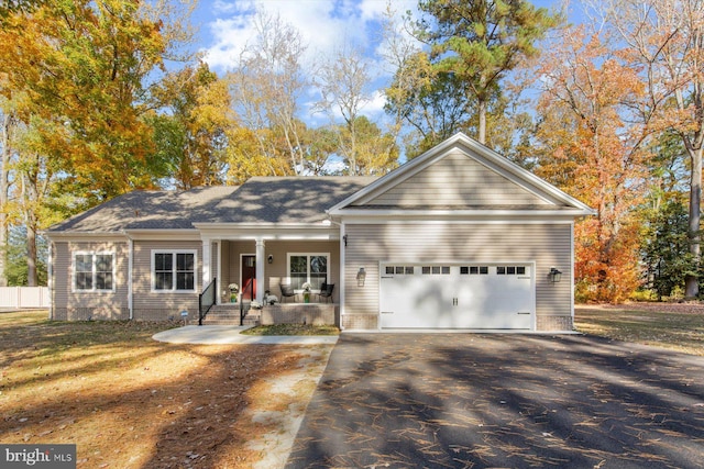 view of front facade with covered porch and a garage