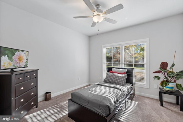 bedroom with ceiling fan and light colored carpet