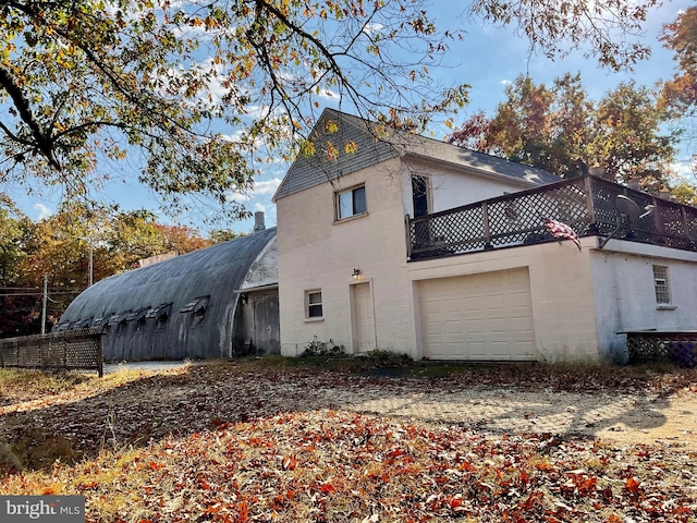 view of side of home with a garage