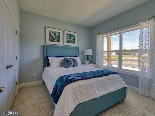 carpeted bedroom with a closet