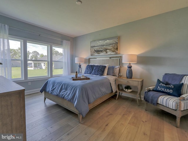 bedroom with light hardwood / wood-style floors