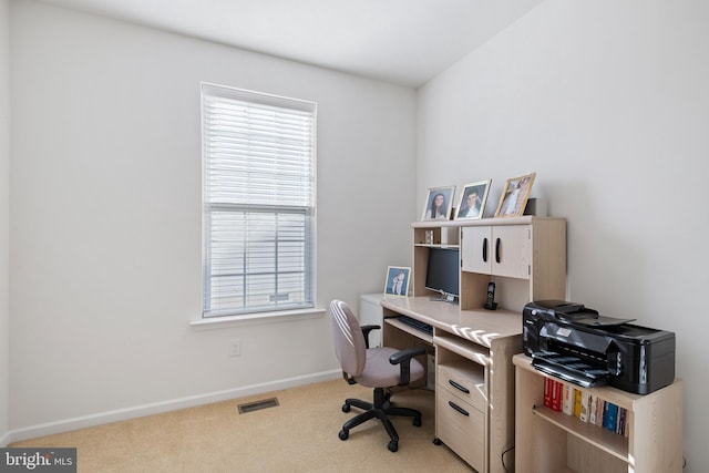 office area featuring light colored carpet