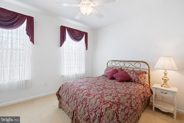 bedroom with ceiling fan and carpet