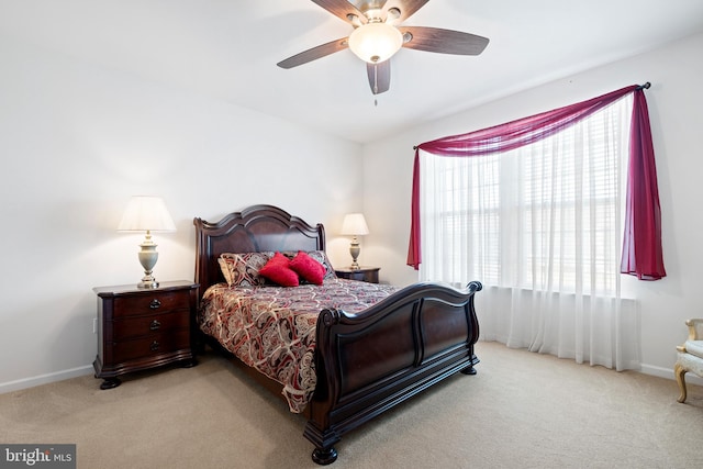 bedroom featuring ceiling fan and light carpet