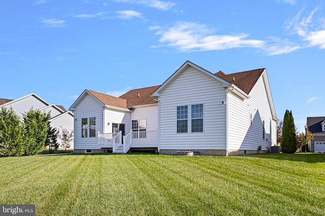 rear view of house with a lawn