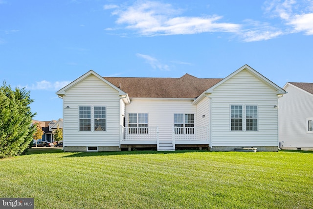 back of property featuring a yard