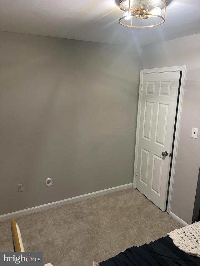 unfurnished bedroom featuring light carpet