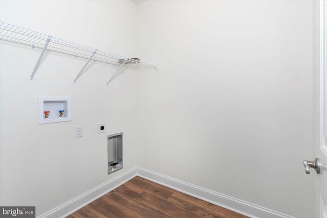 laundry area with hookup for a washing machine, electric dryer hookup, and dark hardwood / wood-style flooring