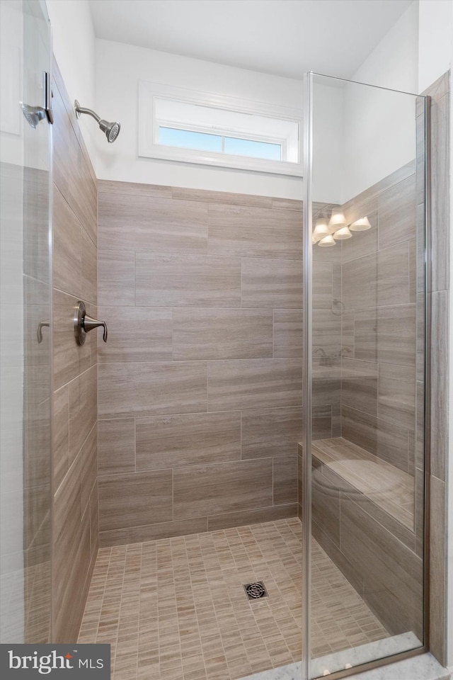 bathroom featuring an enclosed shower