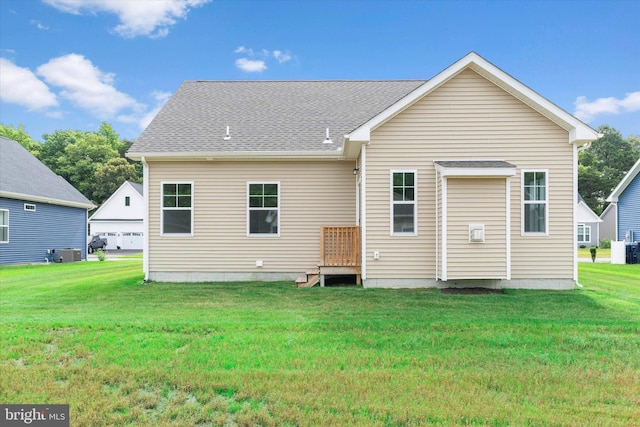 back of property with a yard and cooling unit