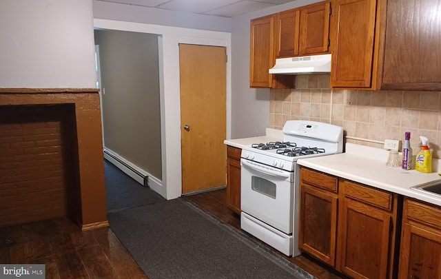 kitchen featuring white gas stove, dark wood-type flooring, and baseboard heating