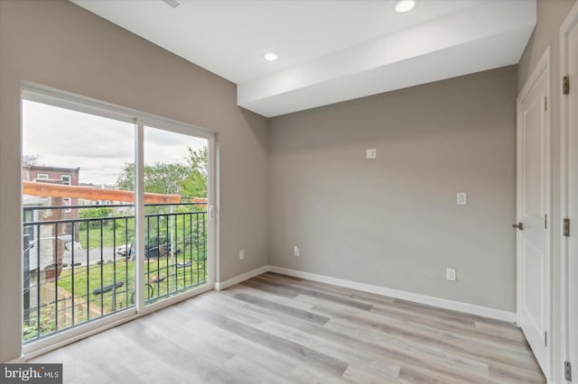 unfurnished room with light hardwood / wood-style floors