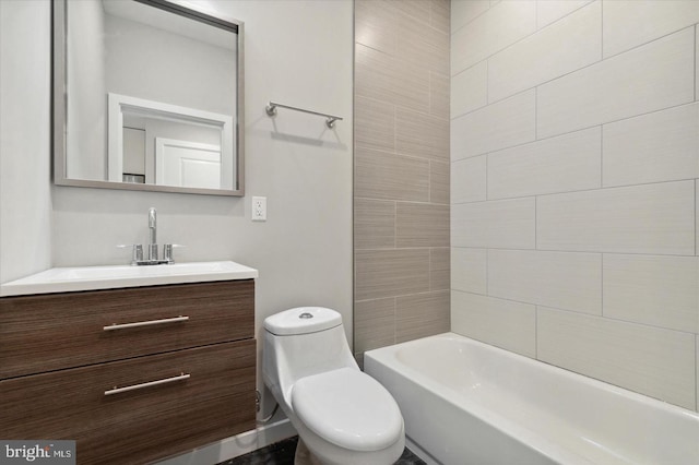 full bathroom with vanity, toilet, and tiled shower / bath