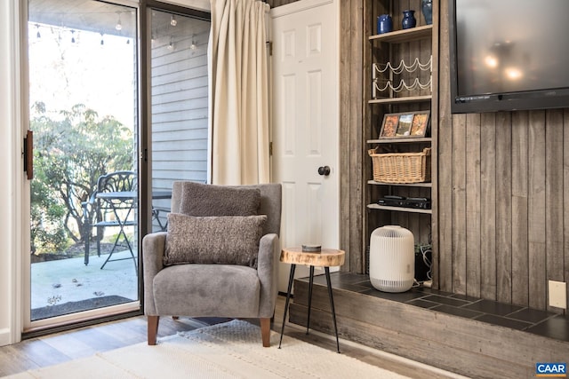 sitting room featuring a wealth of natural light and hardwood / wood-style flooring