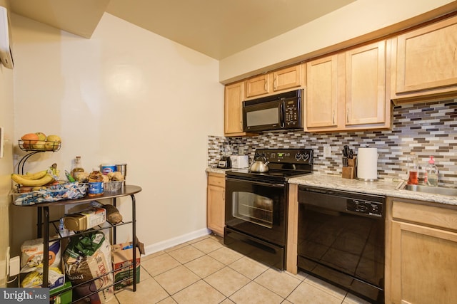 kitchen with tasteful backsplash, black appliances, light tile patterned flooring, an AC wall unit, and light brown cabinets