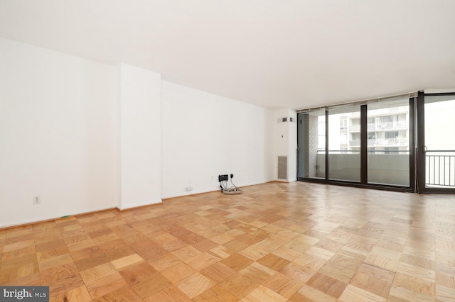 unfurnished room with light parquet floors