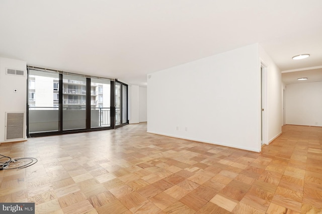 spare room with light parquet floors