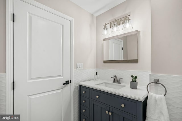 bathroom featuring tile walls and vanity