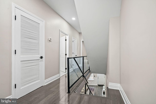 corridor featuring dark hardwood / wood-style floors