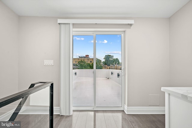 doorway to outside with hardwood / wood-style floors