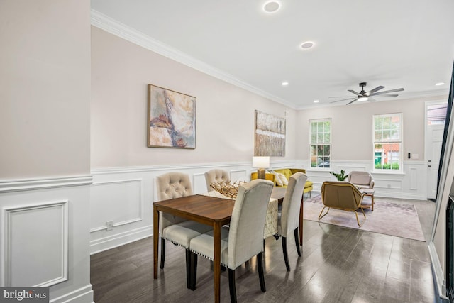 dining room featuring ceiling fan, dark hardwood / wood-style floors, and crown molding